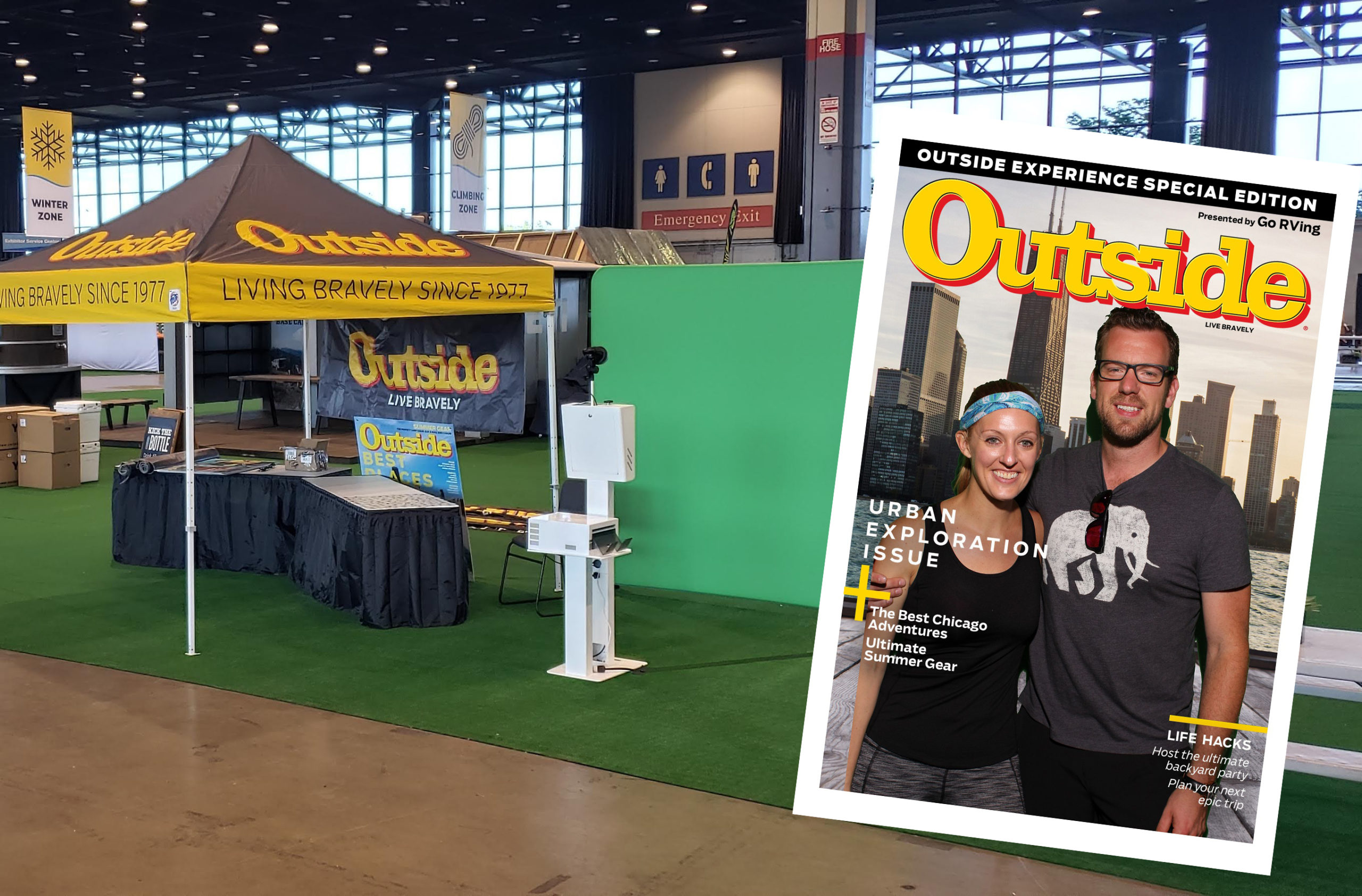 A trade show booth with a yellow Outside tent, promotional materials on tables, and a floor mat. A large magazine cover with two smiling people and the title Urban Exploration Issue is displayed in the foreground.