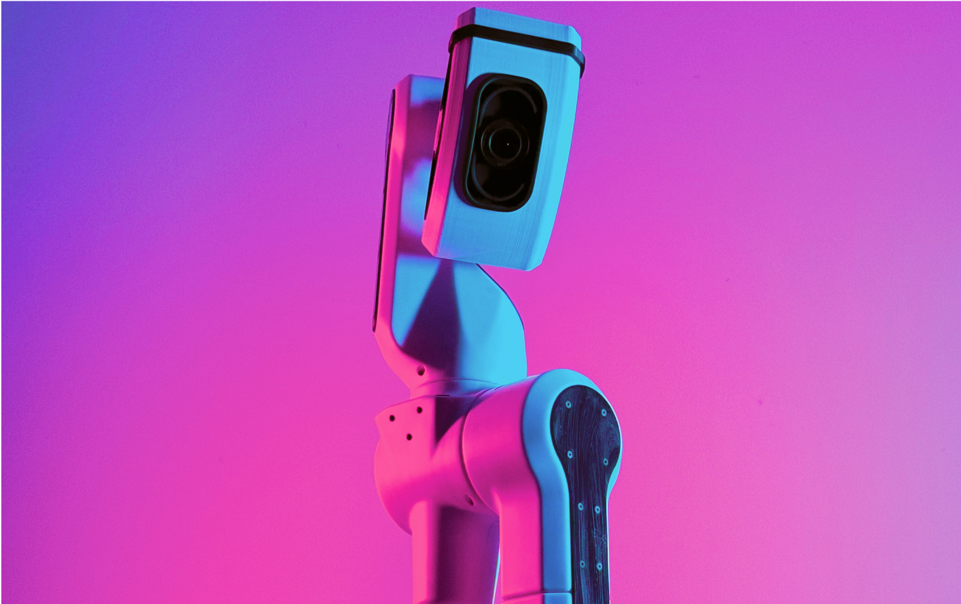 A futuristic robot stands in front of a glambot-booth, against a vibrant pink and purple gradient background. Its design features a sleek, articulated body with visible joints and a camera-like head.