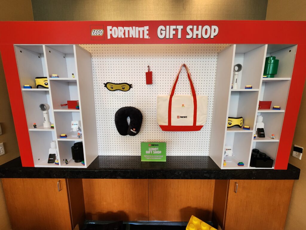 A LEGO Fortnite gift shop display featuring themed merchandise, perfect for fans attending the Nina Pool Tiktok Star Meet & Greet in Chicago.