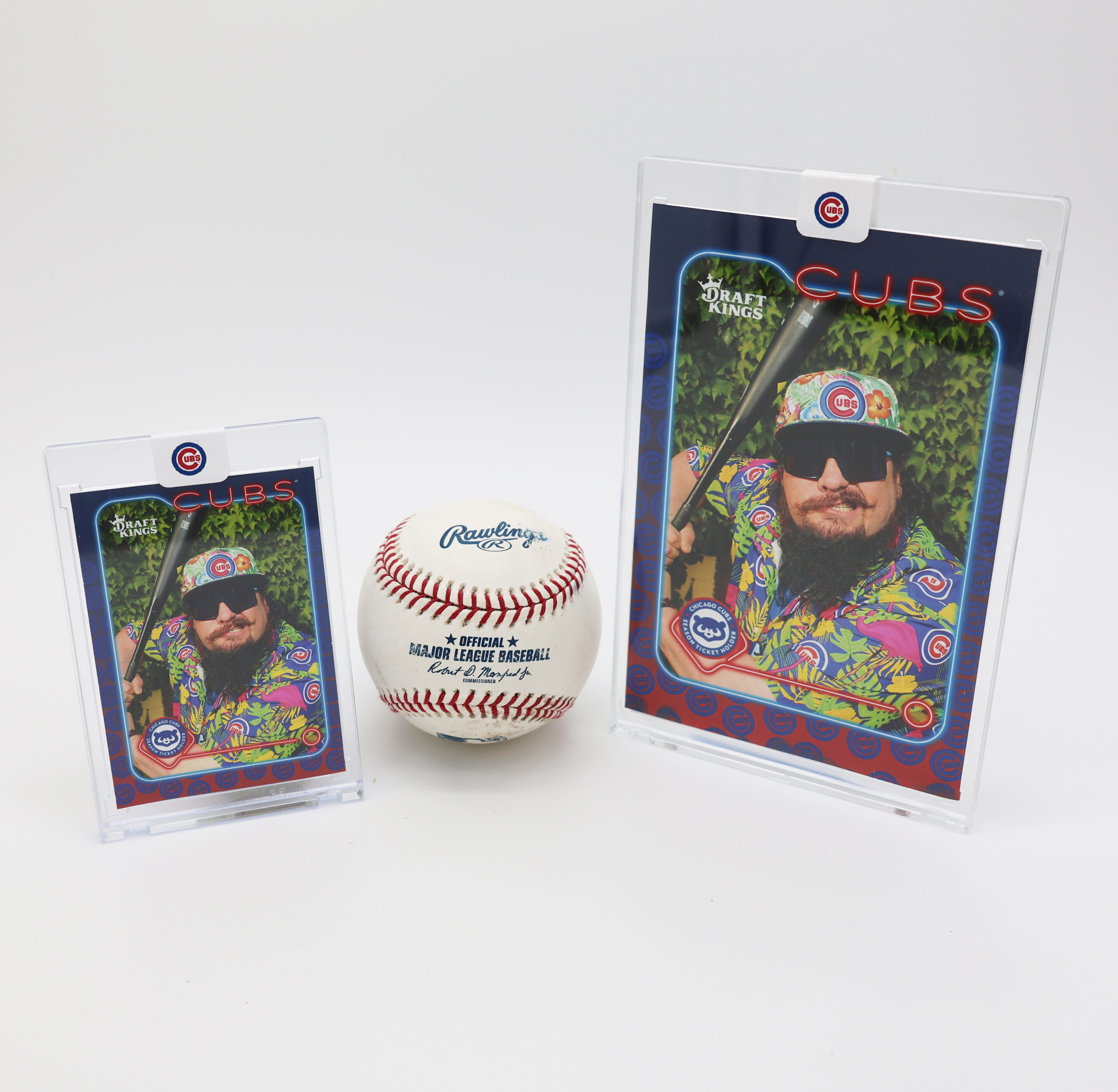 A Rawlings baseball sits between two Chicago Cubs trading cards and a person in sunglasses, alongside a Custom Photo Keychains for Events display, all on a white background.